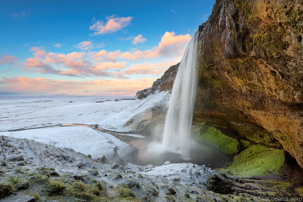 Seljalandsfoss - One of the most spectacular waterfalls in Iceland, covered with a blanket of beautiful snow.